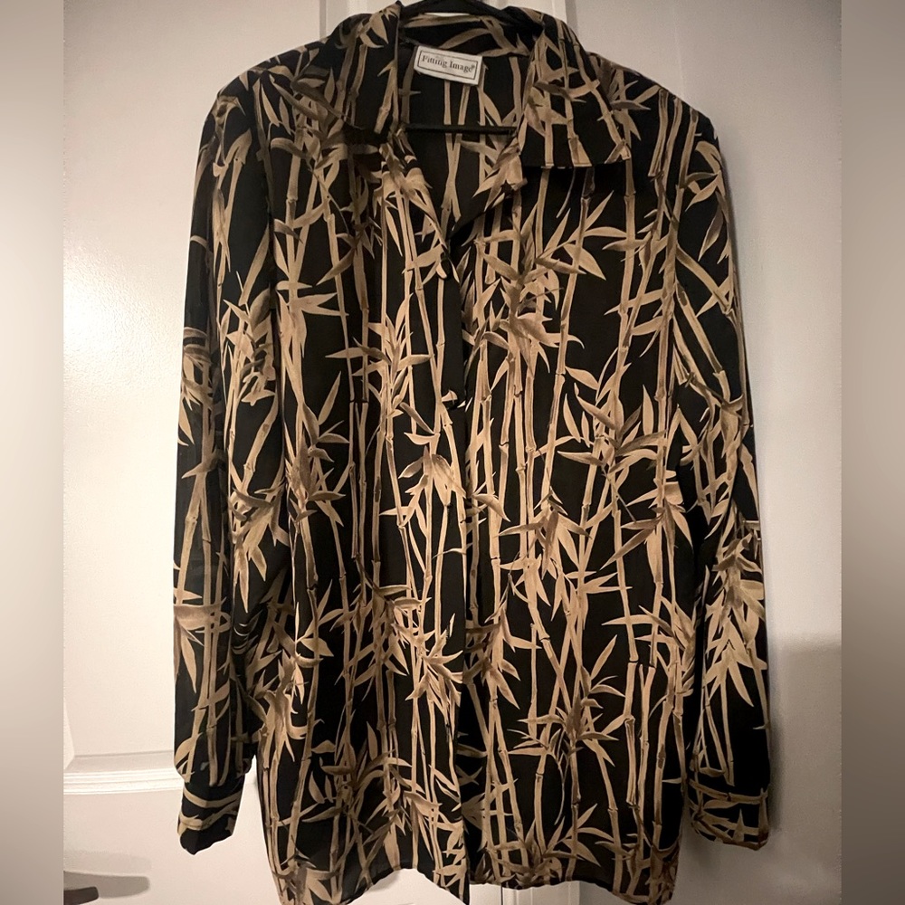 Long sleeve, thin kind of see through with shoulder pads long sleeve button up.
